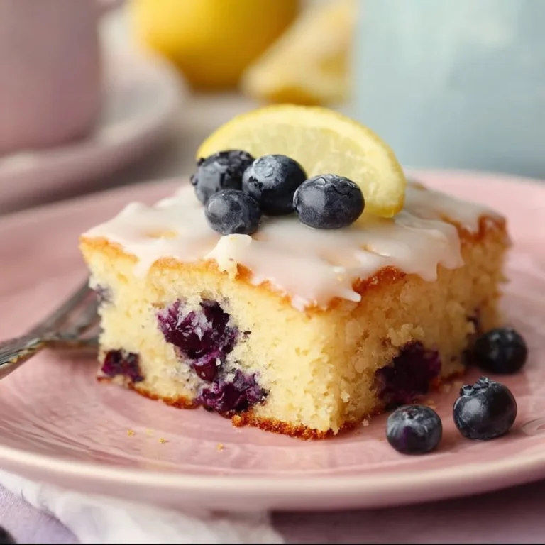 Lemon blueberry sheet cake with fresh berries and lemon icing