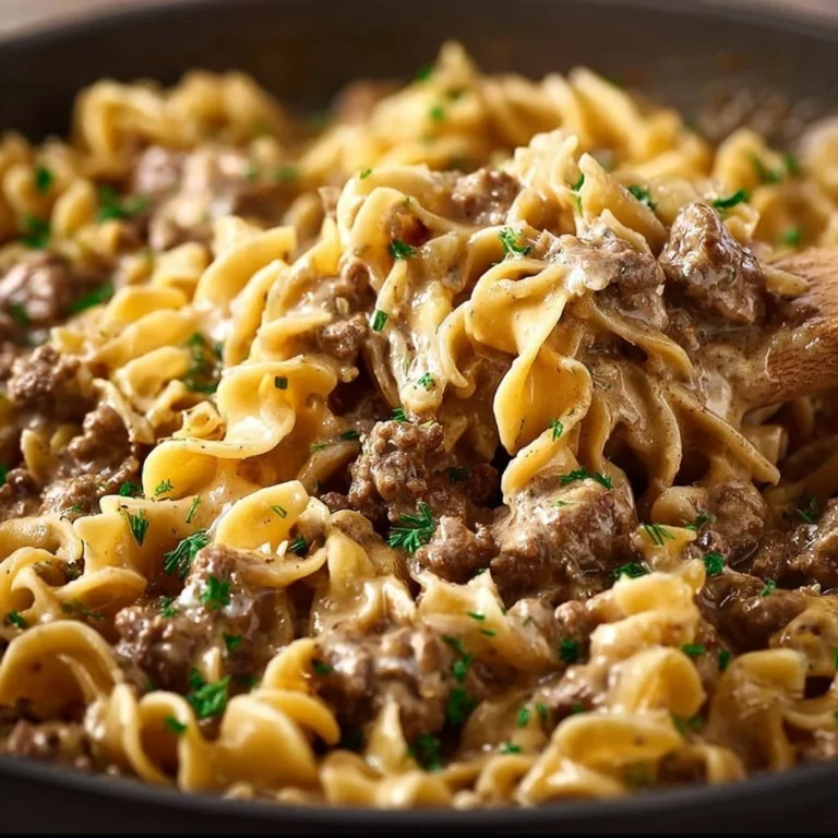Simple ground beef stroganoff served in a bowl with mushrooms and noodles